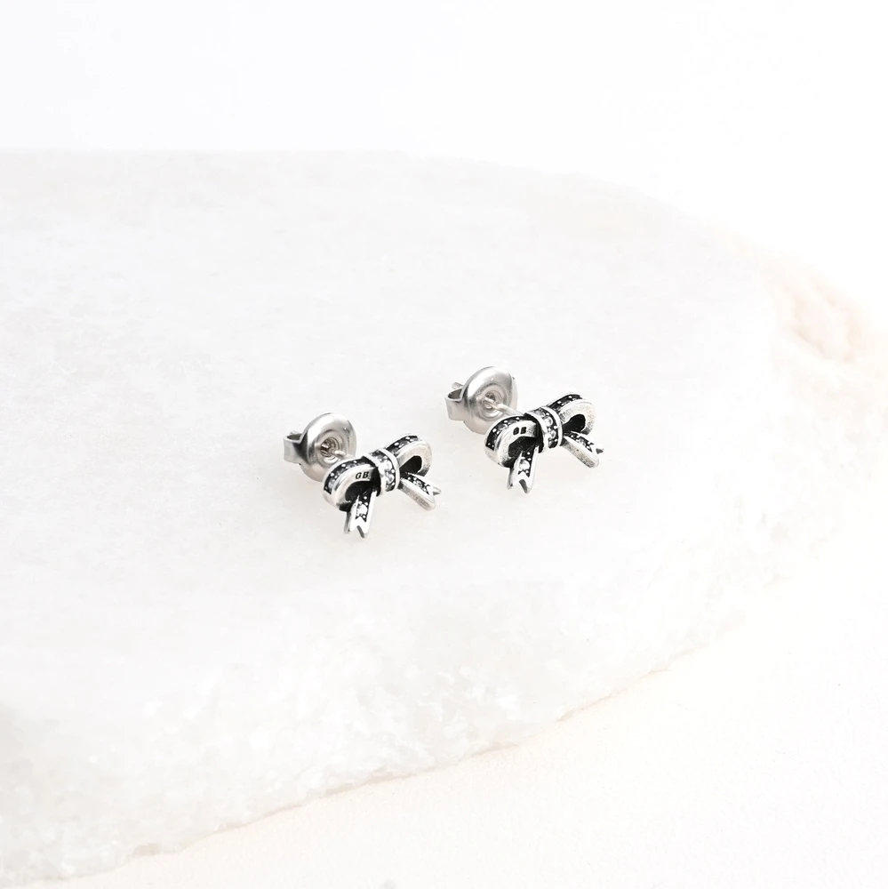 Boucles d\'oreilles en rhodium nœud GB