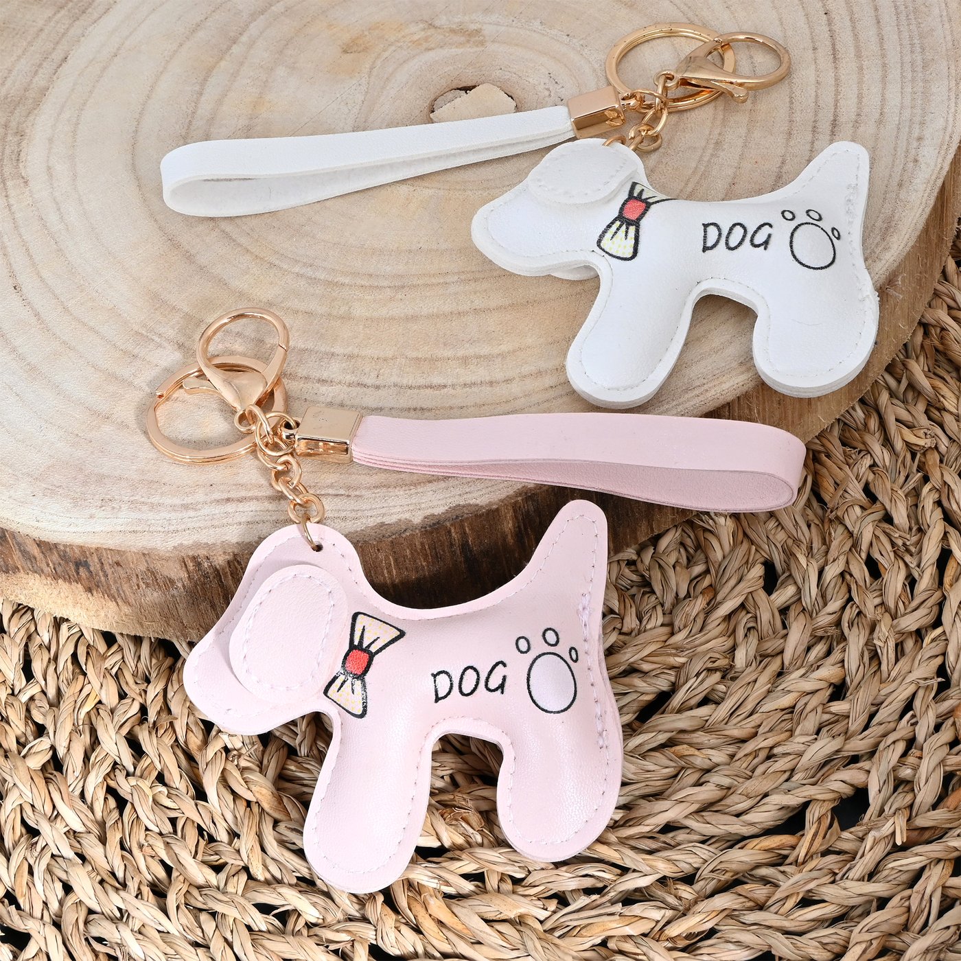 Small dog keychain with a bow