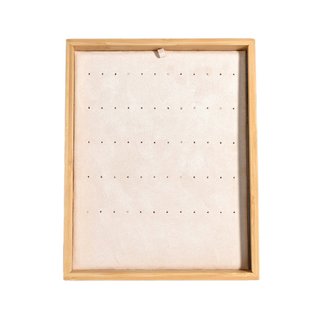 Présentoir beige pour boucles d'oreilles diverses