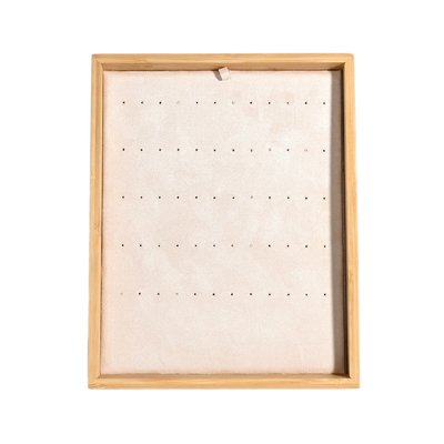 Beige display for assorted earrings